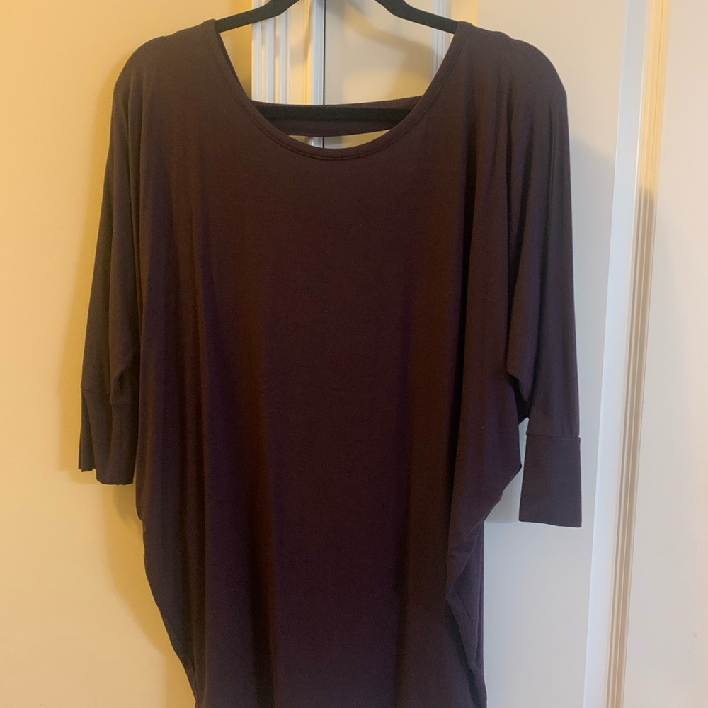3/4 sleeve dark plum top with cut out back. New with tags